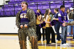 Junior Lane Freeman works to get the crowd pumped at the first pep rally of the year.