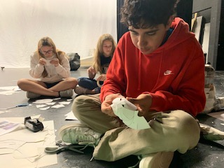 Senior Omar Almeida, who will play young Simba in the upcoming musical The Lion King, works on creating his mask.