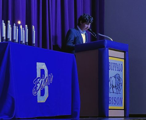 Senior Omar Almeida address the crowd at the joint induction ceremonies of the National Honor Society and the Spanish Honor Society.