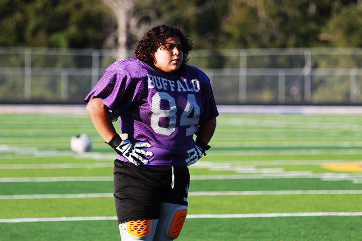 Sophomore Maylene Caceres watches as some of the team moms take their turn at punting at s special football event last month.