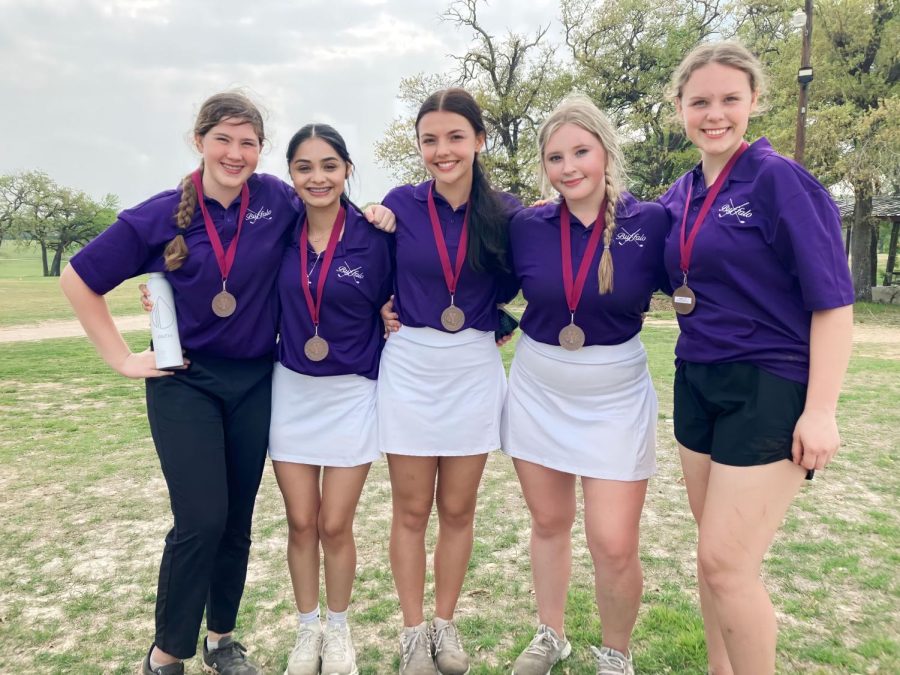 The Lady Bison golfers show off their medals from the Cameron tournament.