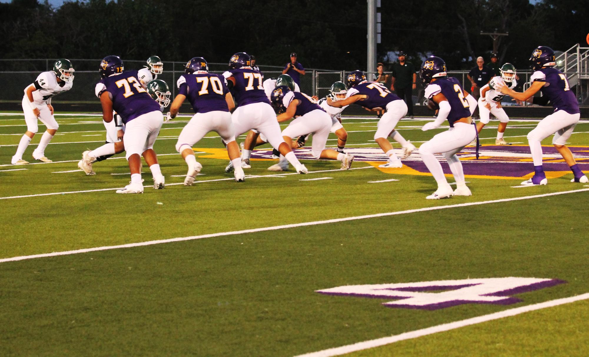 The Bison work together on an offensive play while taking a victory over Normangee in their homecoming game.