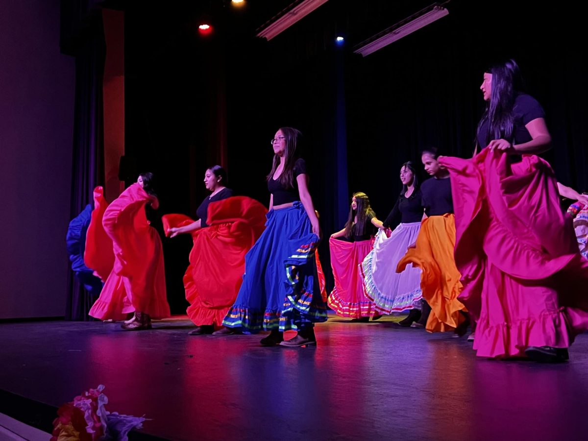 Spanish Club students perform at the Hispanic Heritage program to celebrate Hispanic Heritage Month. The program is put on annually by the group. 