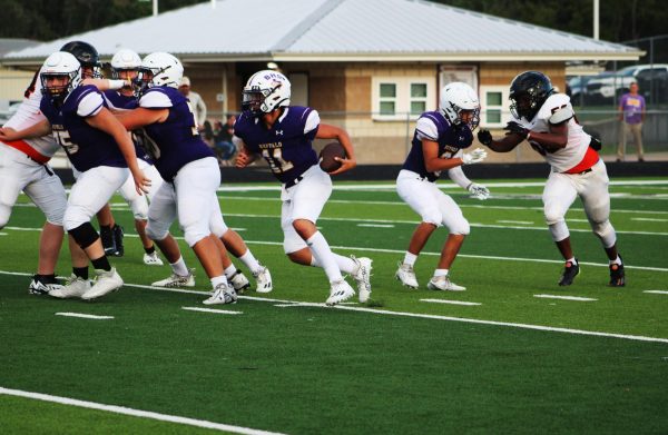 Mason Nedbalek carries the ball in an attempt to push up the Bison score. The offense snagged six points early on but struggled for the rest of the game, although they won the game after the defense held Centerville to eight first downs.