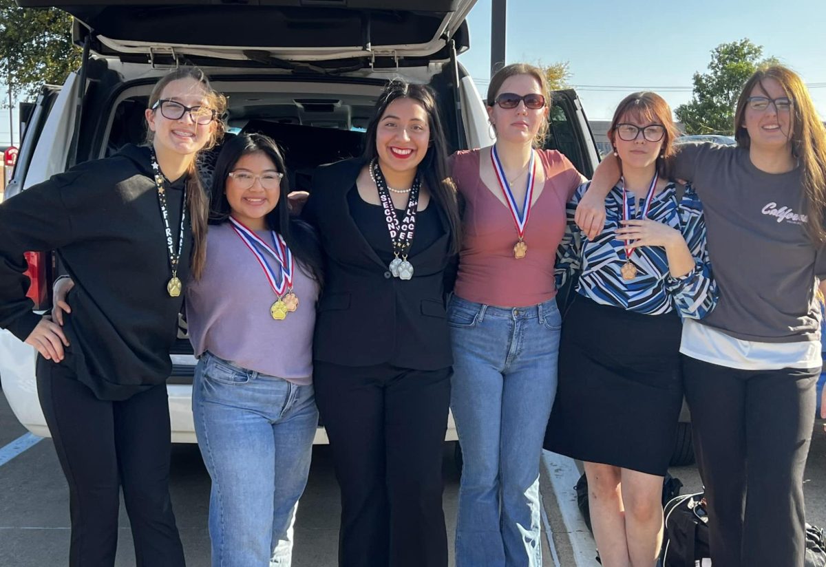 Speech students show off their medals before leaving Princeton to head home from their biggest meet of the year so far.