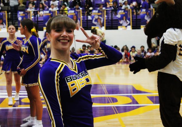 Senior Aliya Ingram gets ready to cheer before a pep rally.