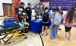 Students visit with Kilgore College representatives about their Firefighter Training Program.