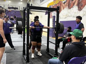 Powerlifter Maylene Caceres gets ready to lift at the meet the Bison hosted Wednesday night. 